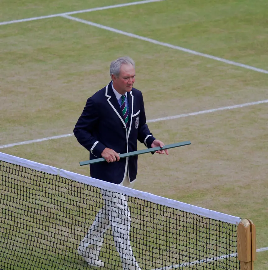 Chair umpire standing on court before a match