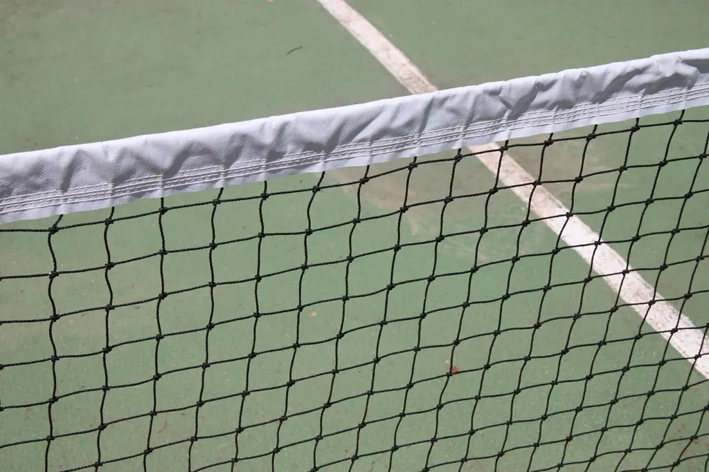 Close-up of a tennis net and its top tape