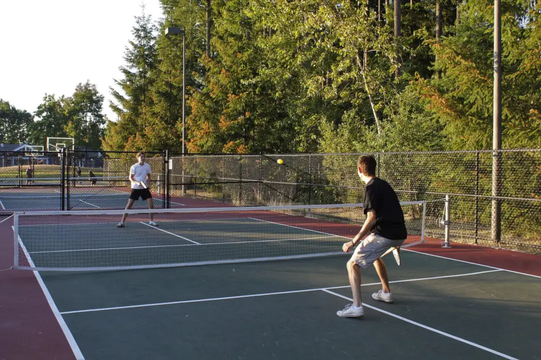 Pickleball players on an outdoor court